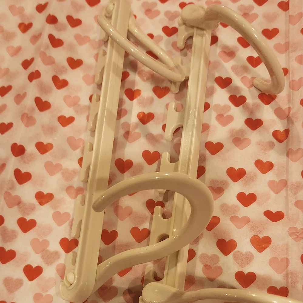 cream off white plastic space saver closet clothing hanger